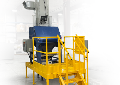 Bag break hopper with dust containment system, operator platform with safety railing and steps, and pointed insert for piercing and unloading bulk bags into downstream processing or material transfer systems.