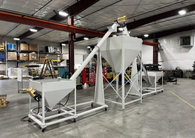Screw conveyors connecting three hoppers